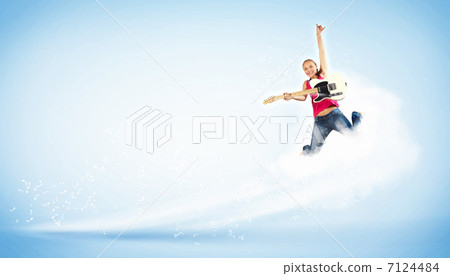 young woman playing on electro guitar and jumping young woman playing on electro guitar and jumping 7124484