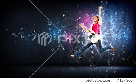 young woman playing on electro guitar and jumping young woman playing on electro guitar and jumping 7124503