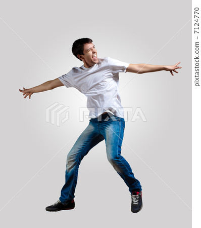 Young man dancing and jumping 7124770