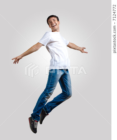 Young man dancing and jumping 7124772