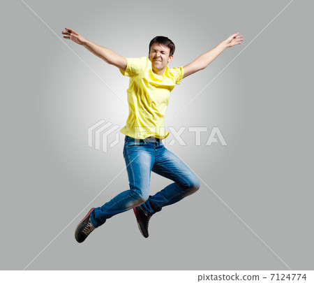 Young man dancing and jumping Young man dancing and jumping 7124774