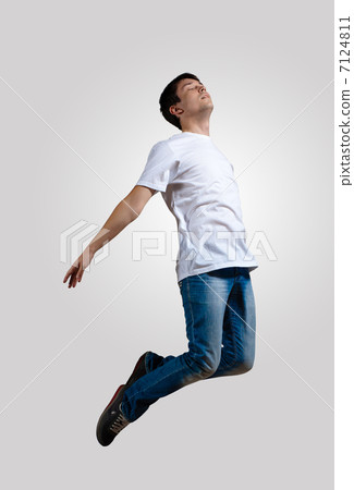 Young man dancing and jumping 7124811