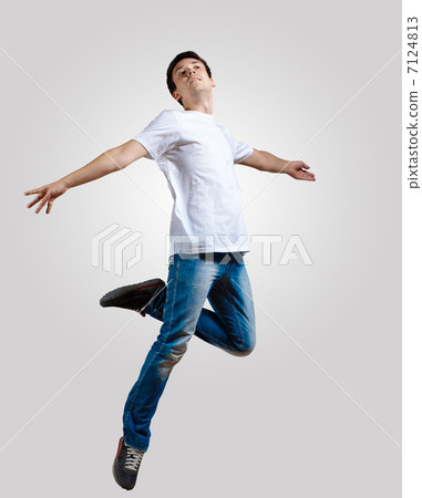 Young man dancing and jumping Young man dancing and jumping 7124813