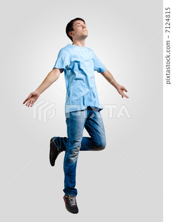 Young man dancing and jumping Young man dancing and jumping 7124815