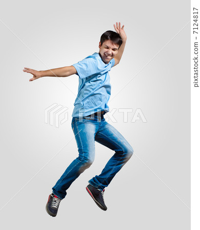 Young man dancing and jumping Young man dancing and jumping 7124817