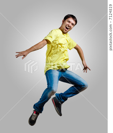 Young man dancing and jumping Young man dancing and jumping 7124819