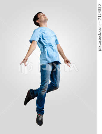 Young man dancing and jumping Young man dancing and jumping 7124820