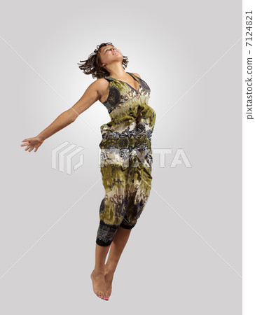 young woman dancing and jumping... young woman dancing and jumping... 7124821