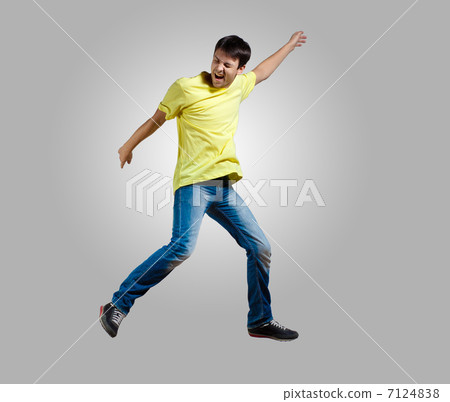 Young man dancing and jumping Young man dancing and jumping 7124838