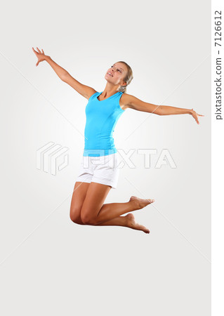 fitness woman jumping excited fitness woman jumping excited 7126612