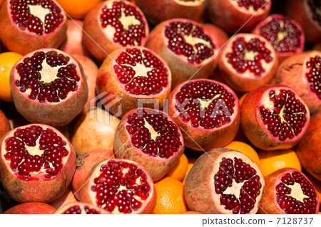 Many fresh pomegranates on market Many fresh pomegranates on market 7128737
