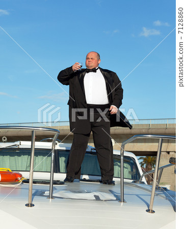 Fat man in tuxedo with glass wine Fat man in tuxedo with glass wine 7128860