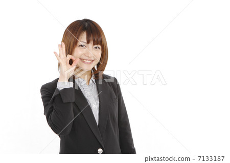 A young woman doing a good sign 7133187