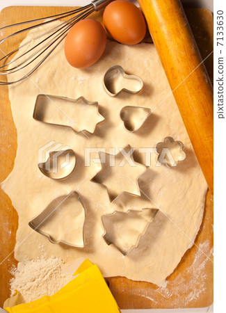 Dough, cookie forms, eggs and eggbeater 7133630