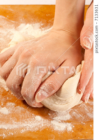 Kneading the dough with hands Kneading the dough with hands 7133631