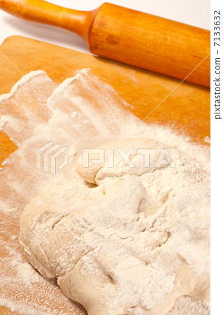 Dough in flour on breadboard 7133632