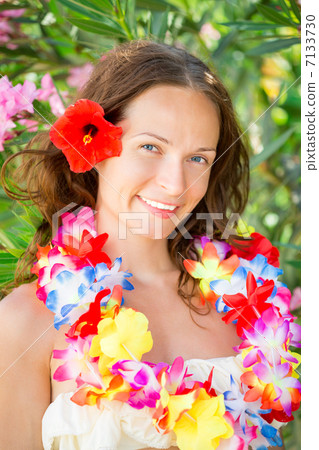 Woman in hawaiian flowers garland 7133730