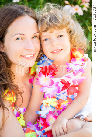 Happy woman with child on the beach Happy woman with child on the beach 7133734