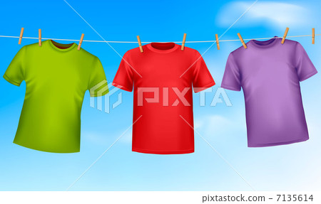 Set of colored t-shirts hanging on a clothesline. Set of colored t-shirts hanging on a clothesline. 7135614