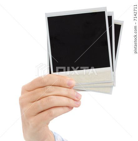 hand holding instant photo hand holding instant photo 7142711