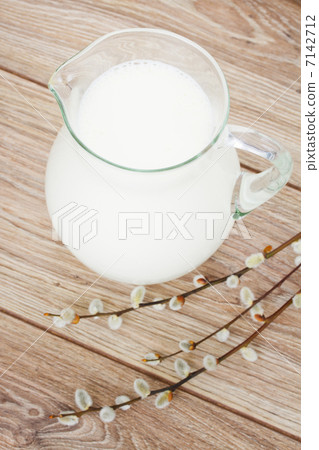 milk on wooden table milk on wooden table 7142712