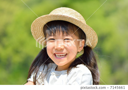 Smiling girl (profile, straw hat) Smiling girl (profile, straw hat) 7145661