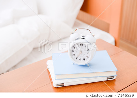 Alarm clock, book and tablet 7146529