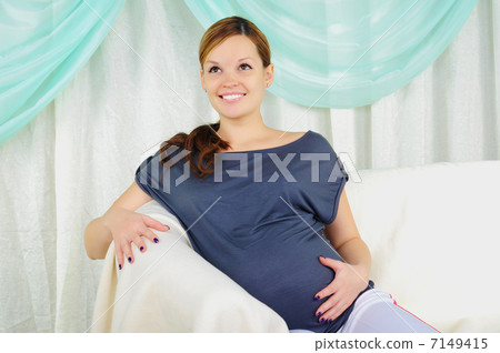 Portrait of a young pregnant girl 7149415
