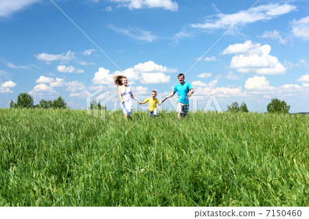 family with son on the meadow 7150460