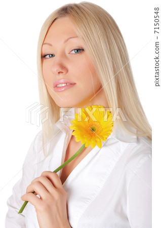 Young smiling blonde in a white shirt Young smiling blonde in a white shirt 7150548
