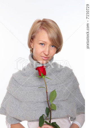 a young pretty woman with a red rose a young pretty woman with a red rose 7150729
