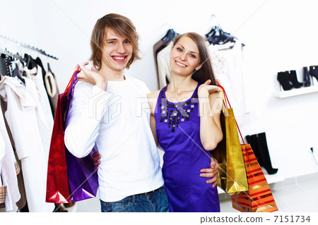 Young couple doing shopping together Young couple doing shopping together 7151734
