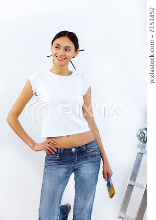 Young woman with paint brushes 7151852