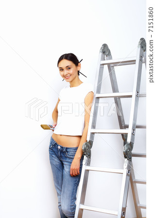 Young woman with paint brushes Young woman with paint brushes 7151860