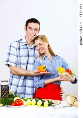 Husband and wife together coooking at home Husband and wife together coooking at home 7152565