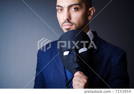 Man with black mask in studio 7153954