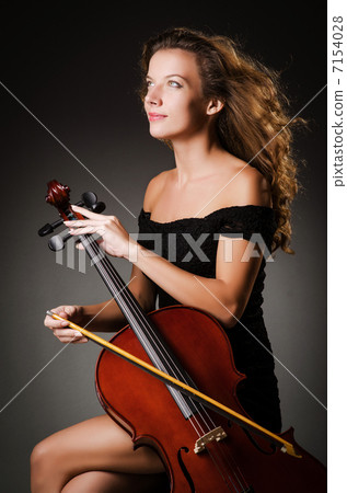 Woman performer with cello  in studio 7154028