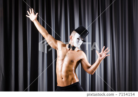 Muscular actor with mask against curtain Muscular actor with mask against curtain 7154154