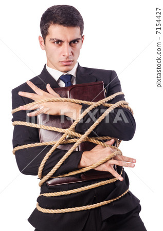 Businessman tied up with rope on white Businessman tied up with rope on white 7154427