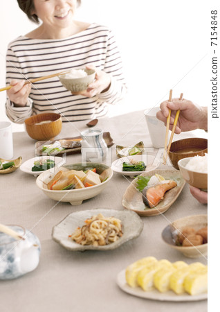 Senior woman eating breakfast 7154848