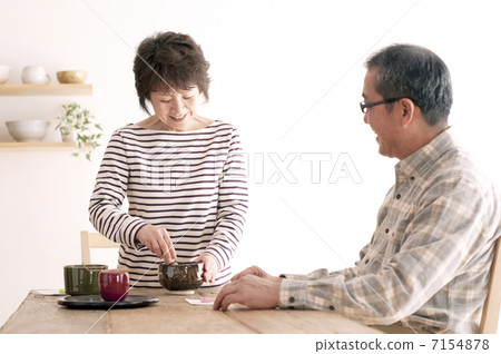 Senior couple enjoying the tea ceremony 7154878