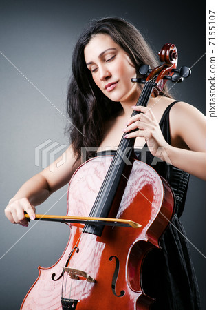 Woman cellist performing with cello 7155107