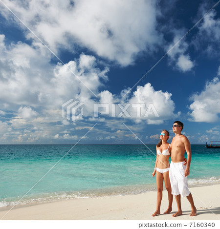 Couple on a beach at Maldives Couple on a beach at Maldives 7160340