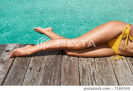 Woman at beach jetty Woman at beach jetty 7160349