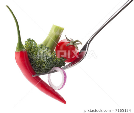 Fresh raw vegetables on fork isolated on white background cutout Fresh raw vegetables on fork isolated on white background cutout 7165124