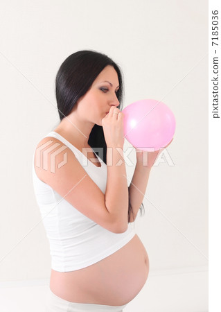 pregnant woman with pink balloon pregnant woman with pink balloon 7185036