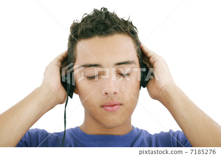 Boy listening to the music, isolated on white Boy listening to the music, isolated on white 7185276