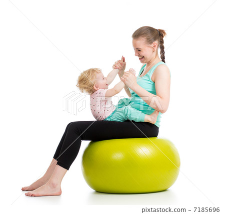 mother with baby having fun with  gymnastic ball 7185696