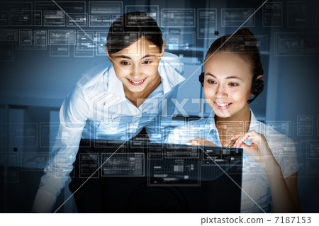 Young woman in business wear and headset Young woman in business wear and headset 7187153