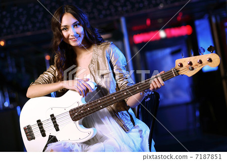 Young guitar player performing in night club Young guitar player performing in night club 7187851